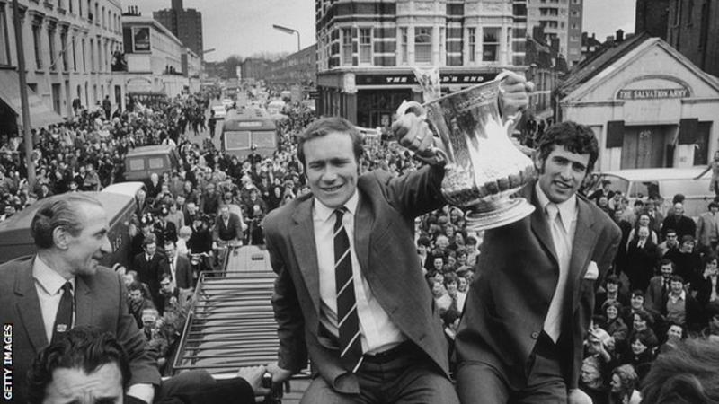 Ron Harris and Peter Bonetti [right] celebrate winning the 1970 FA Cup in an open-top bus celebration that closed off London’s King’s Road.