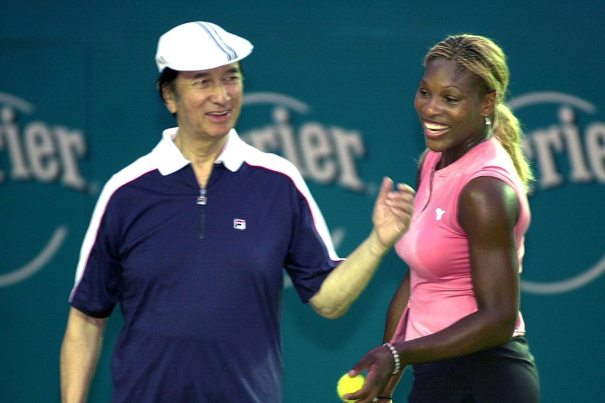 Stanley Ho and Serena Williams playing an exhibition tennis match