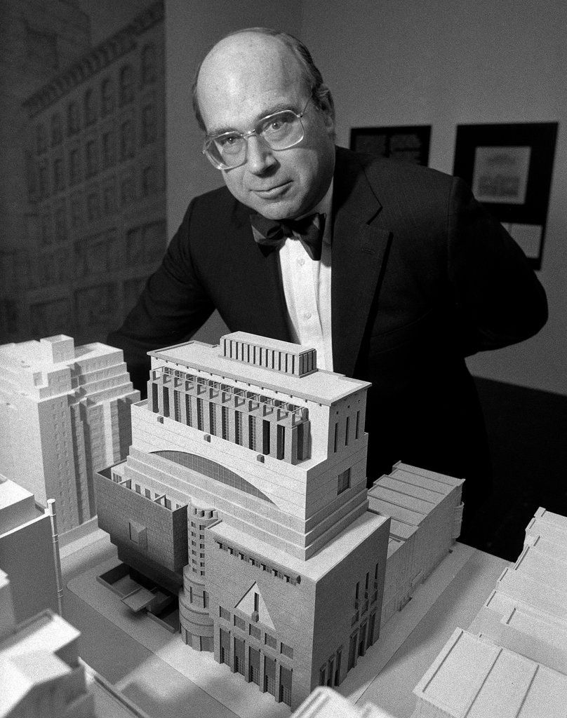 Thomas N Armstrong in front of a model of the Whitney Museum
