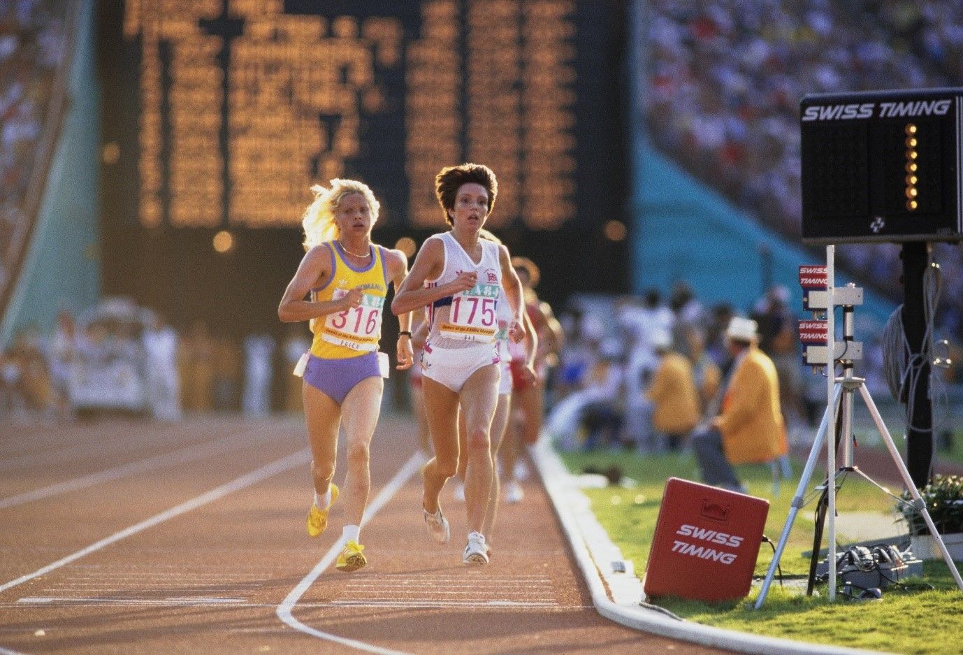A group of women running on a track

Description automatically generated with medium confidence